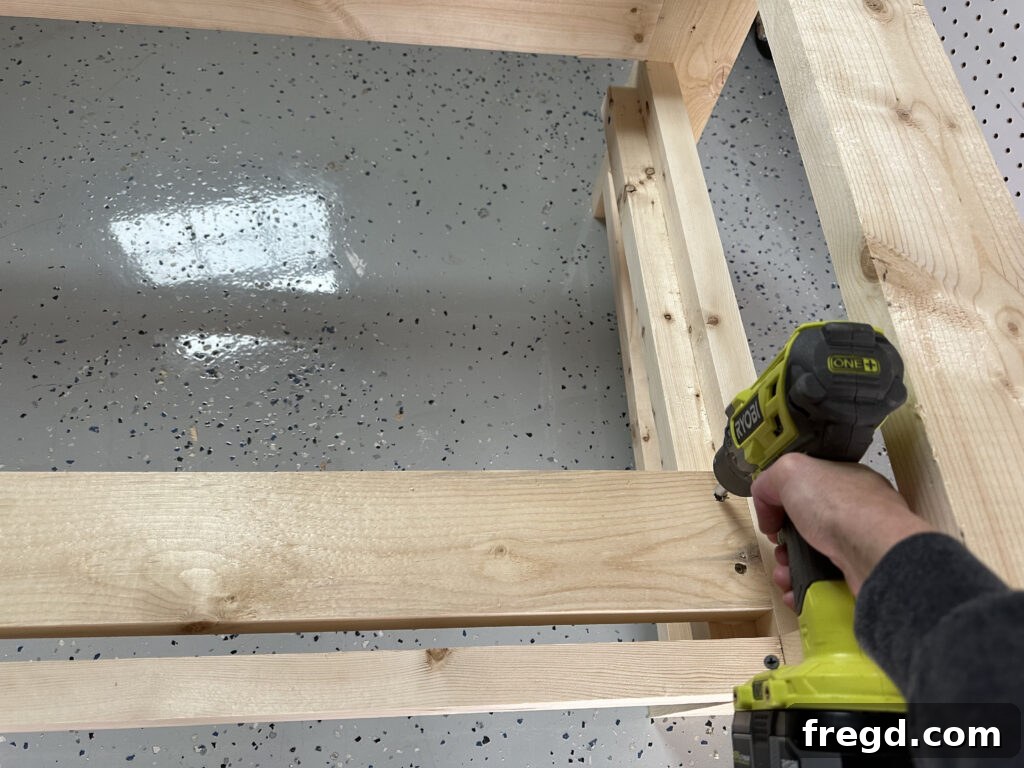 Installing seat slats on the cleats of the outdoor couch
