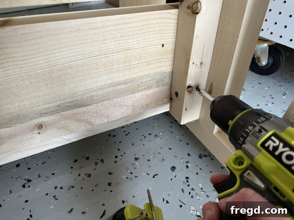 Attaching the assembled backrest to the main couch frame