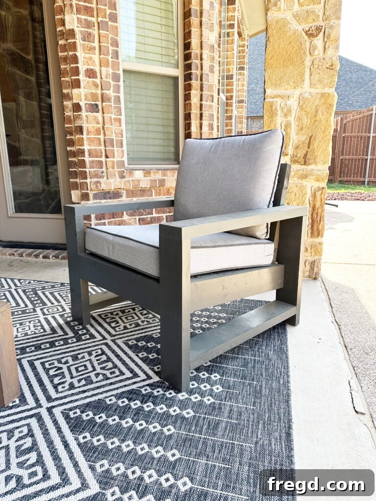A matching DIY Outdoor Chair, painted gray to complement the sofa