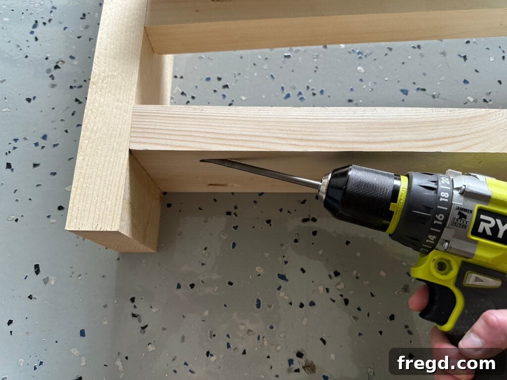 Securing the bottom runner to the arm assembly