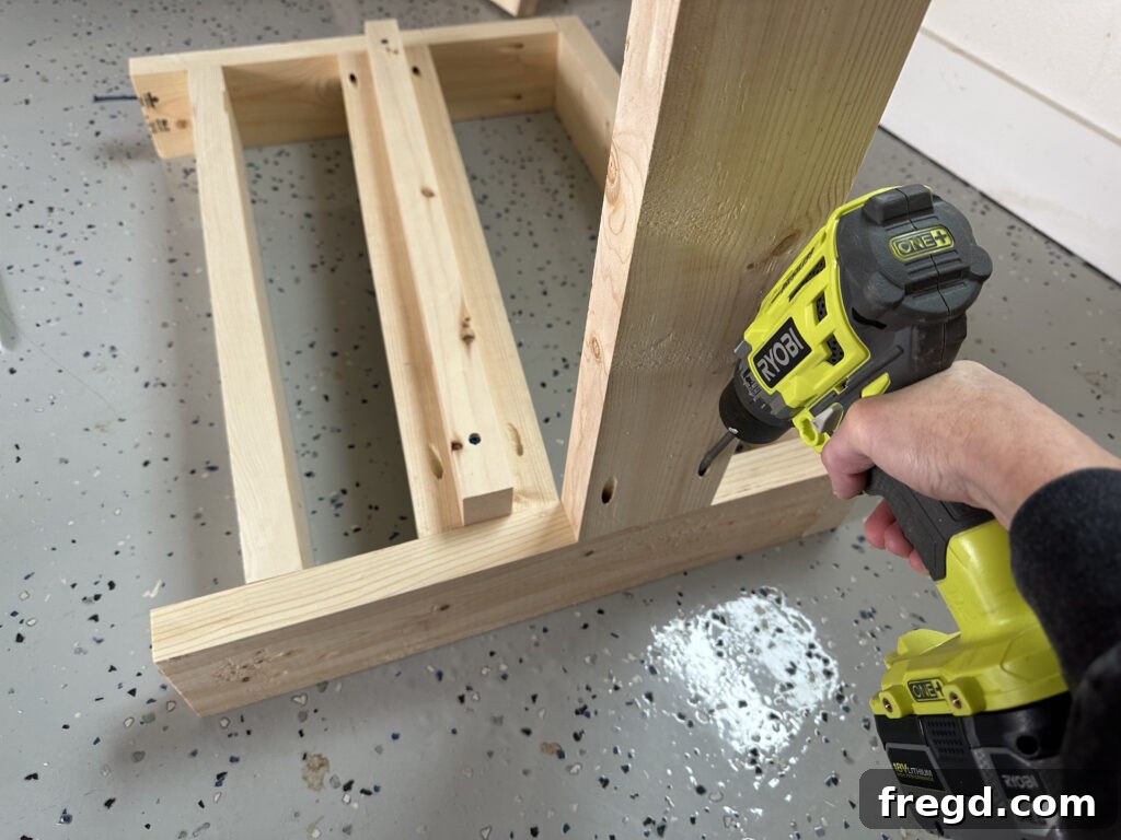 Attaching the back runner to one arm assembly with pocket holes
