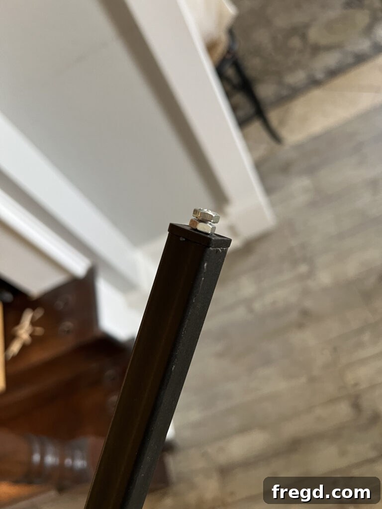 Demonstration of inserting the square Tap N' Twist connector into the bottom of the baluster.