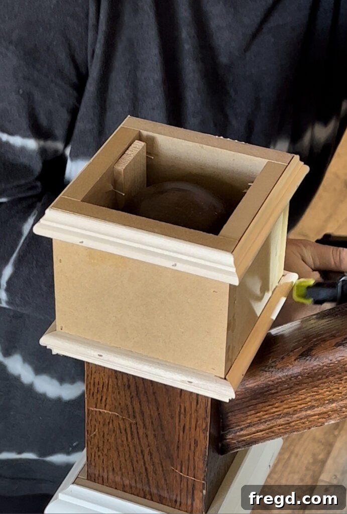 Adding decorative trim and casing to the wrapped newel post to create detail and dimension.