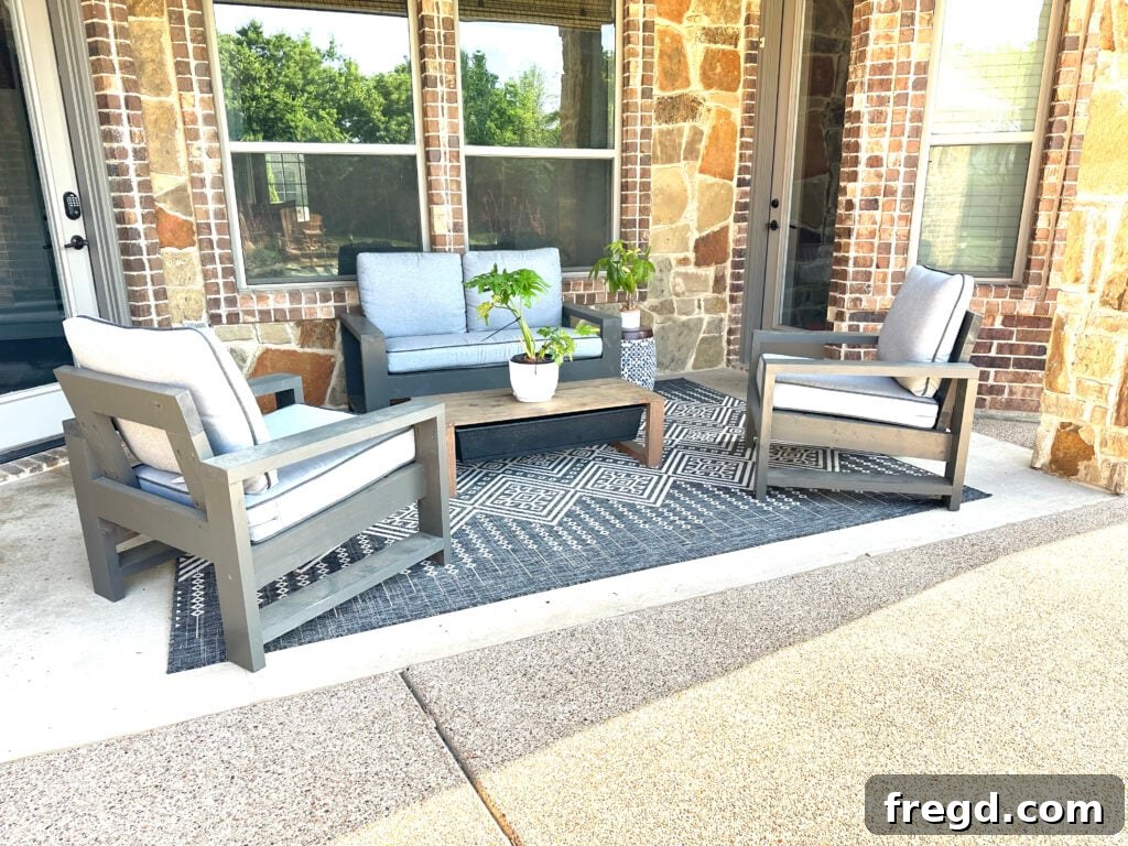 A beautifully finished modern outdoor chair with a cushion, part of a DIY patio set.