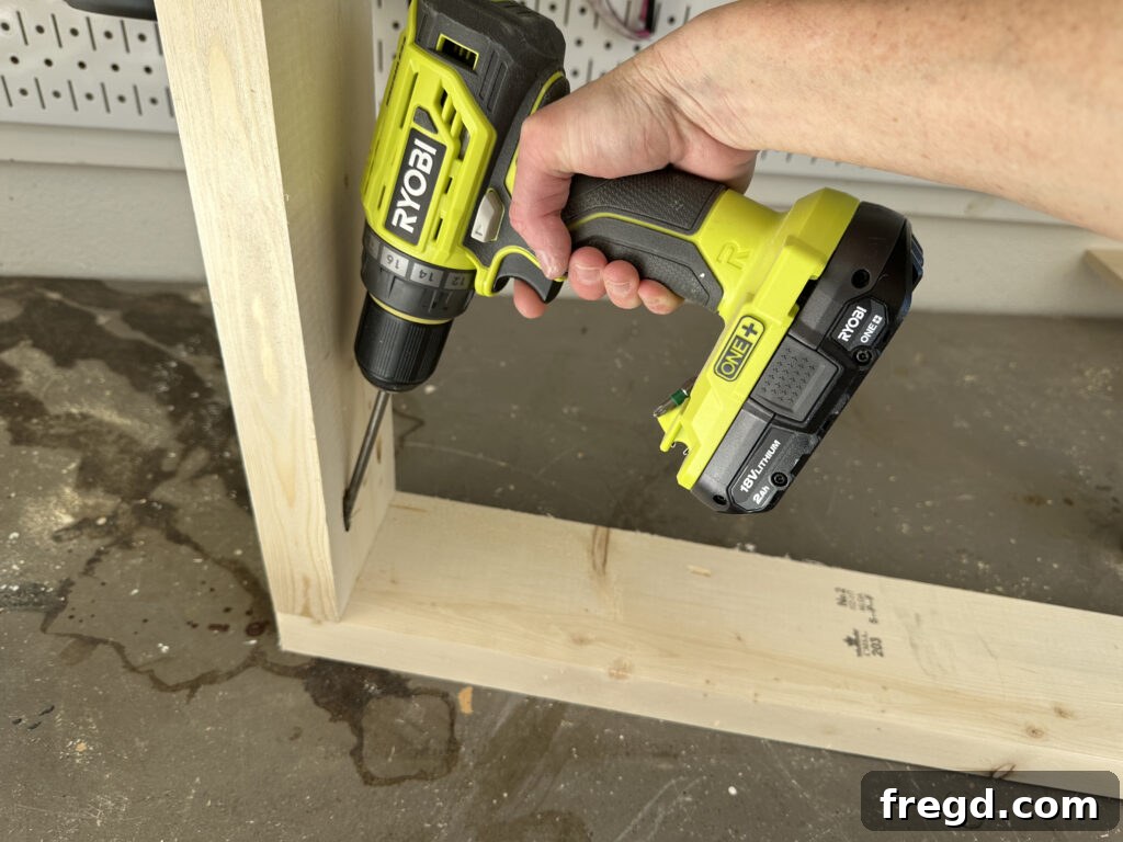 Assembling the arm components of the outdoor chair using pocket hole screws and wood glue.