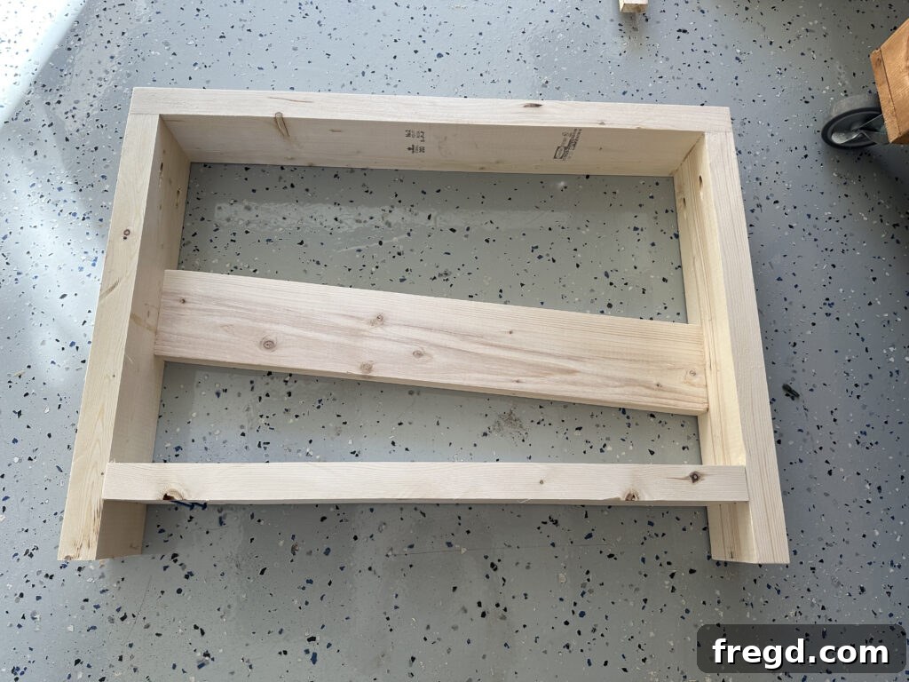 Adding the bottom runners to the side assemblies of the outdoor chair for structural integrity.
