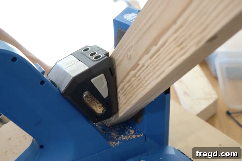 Applying wood glue to a mitered joint before assembly