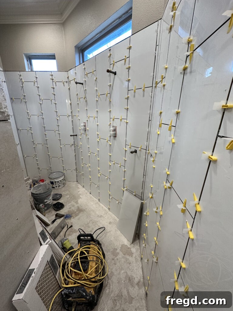 Master Bath Oasis Reimagined 15 Vertical subway tile on shower walls.