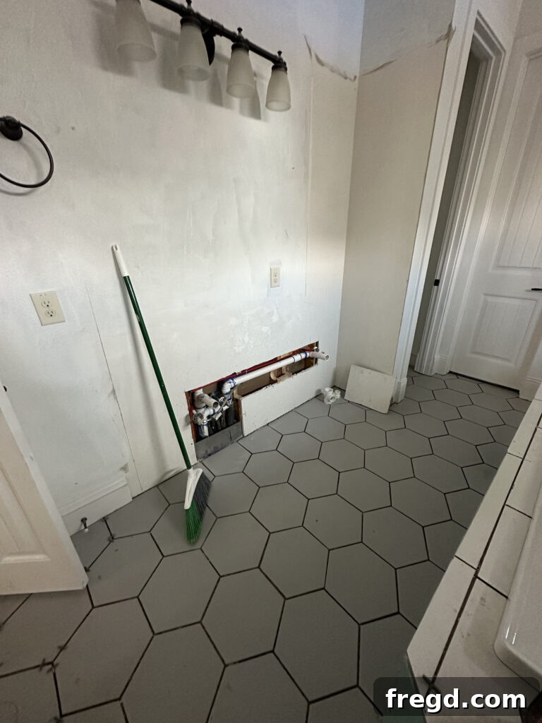 Master Bath Oasis Reimagined 19 Hex tiles on the floor complimenting tub design.