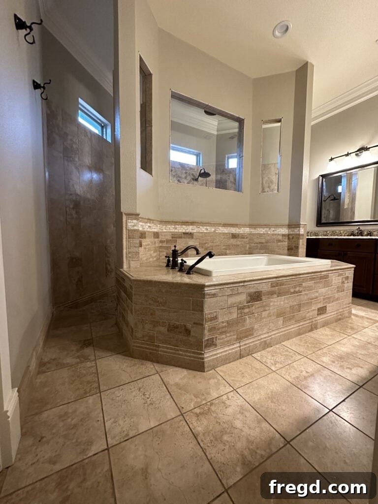 Master Bath Oasis Reimagined 3 Before master bathroom remodel from the other side of the tub.