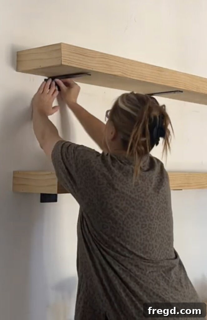Modern Dining Room Makeover DIY Floating Shelves 12 Adding decorative metal brackets to the underside of the floating shelves