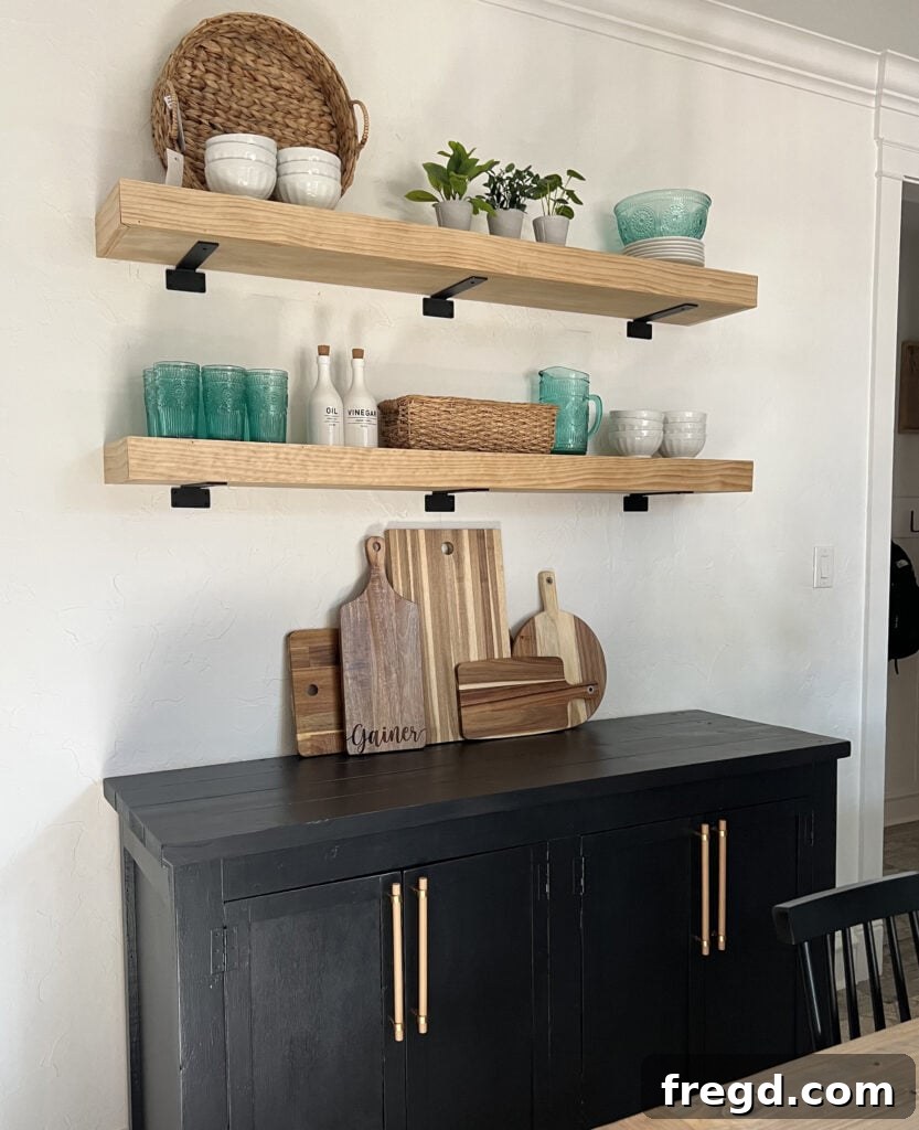 Modern Dining Room Makeover DIY Floating Shelves 13 Finished DIY floating shelves with decorative items in a dining room
