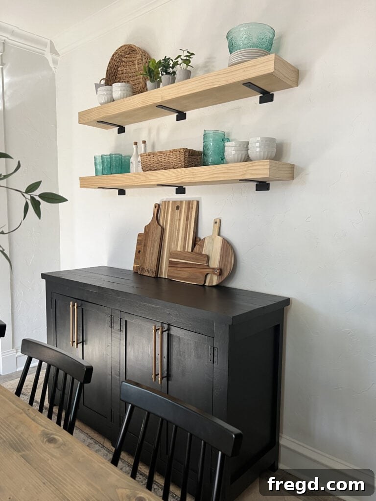 Modern Dining Room Makeover DIY Floating Shelves 14 Close-up of a styled DIY floating shelf showcasing home decor