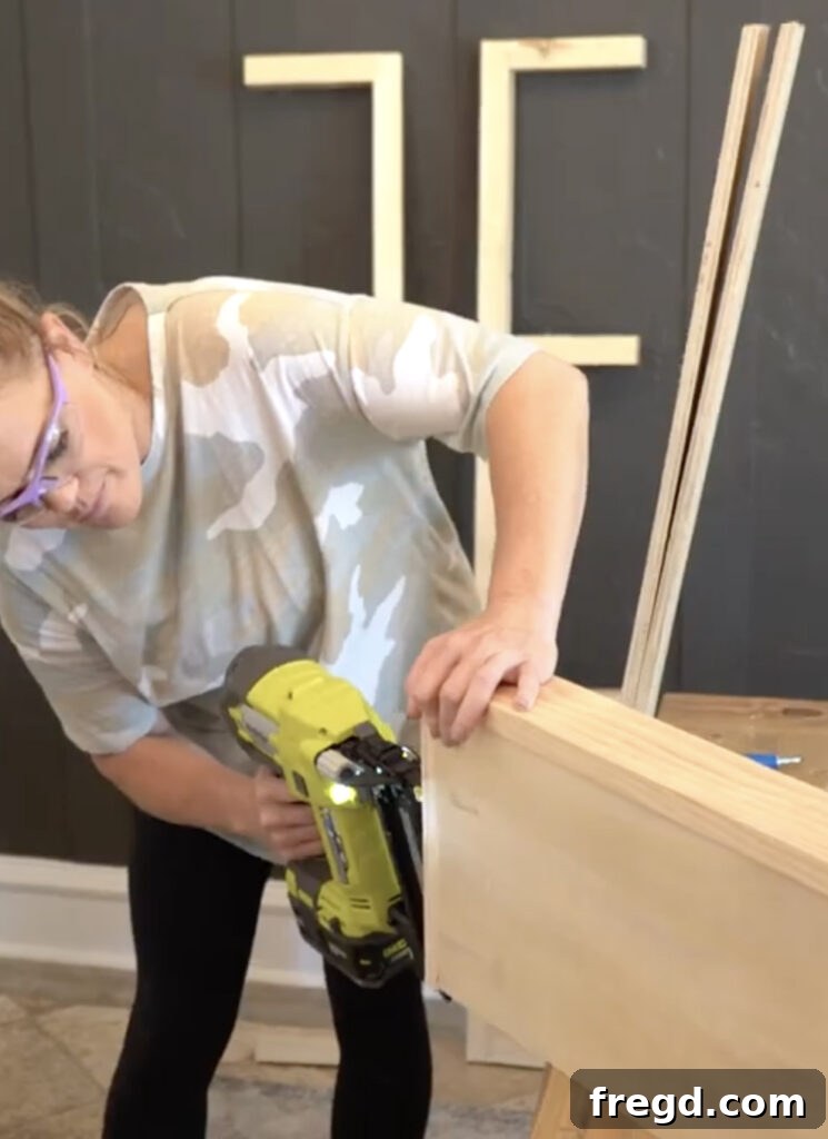 Modern Dining Room Makeover DIY Floating Shelves 5 Assembling the outer shelf box with mitered corners using brad nails and wood glue