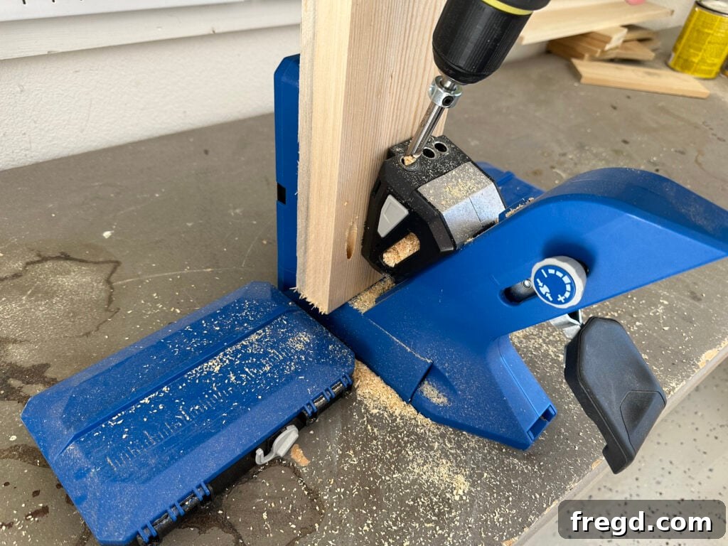 Handcraft a Modern Wood Coffee Table 4 Wood plank with pocket holes drilled along the edge and ends using a Kreg Jig.