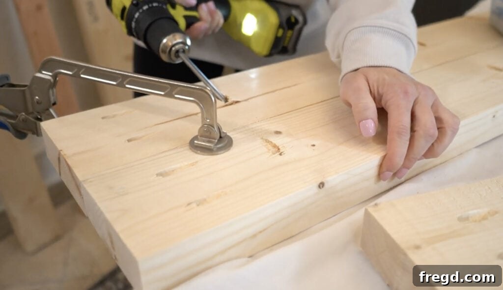 Handcraft a Modern Wood Coffee Table 5 Wood planks joined together with pocket hole screws, secured by Kreg Face Clamps for a smooth finish.