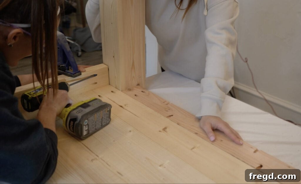 Handcraft a Modern Wood Coffee Table 8 Leg assemblies being attached to the top plank assembly with pocket hole screws and wood glue.