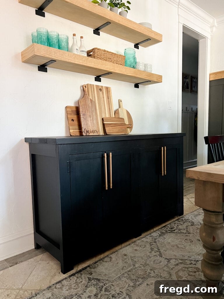Craft Your Own Modern Farmhouse Sideboard 25 The completed DIY Modern Farmhouse Sideboard beautifully decorated for the holidays in a dining room.