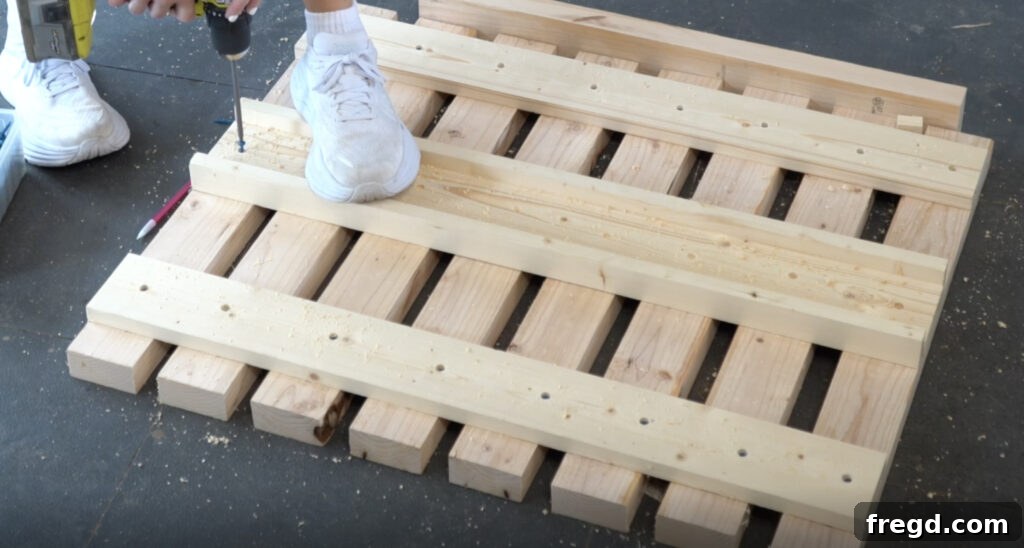 Attaching the completed back track to the center of the backrest assembly