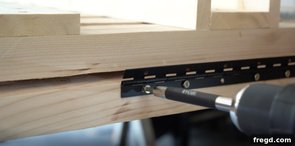 Attaching the back assembly to the seat slats using a piano hinge