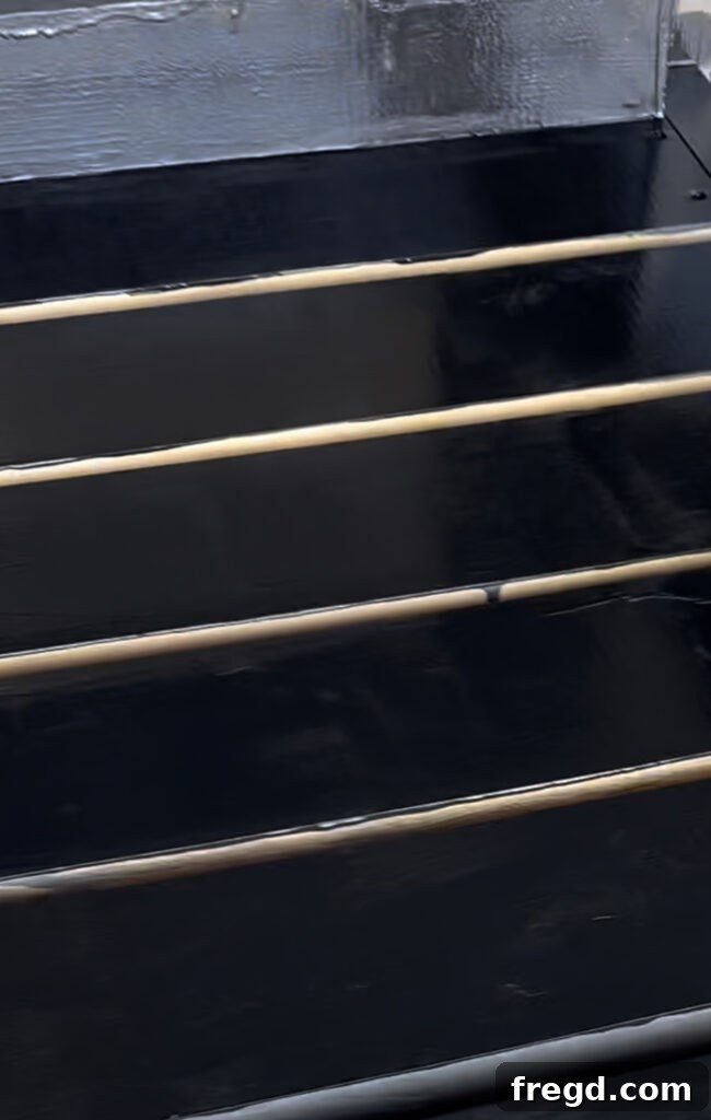 Applying an outdoor-rated paint in Tricorn Black to the finished lounge chair