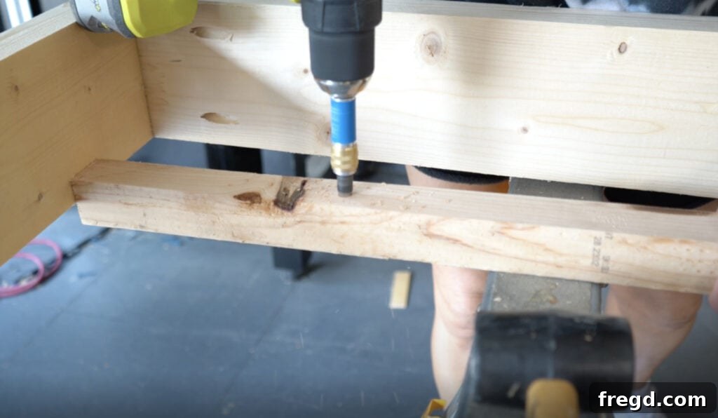 Attaching cleats to the long frame boards with wood screws