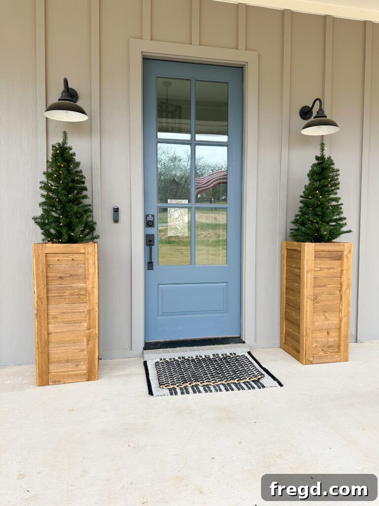 Two cedar planter boxes framing a front door, creating an inviting and symmetrical entrance.