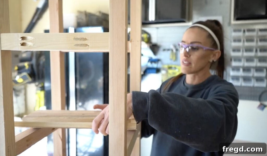 Measuring and cutting shelf pieces to fit inside the assembled planter box frame.