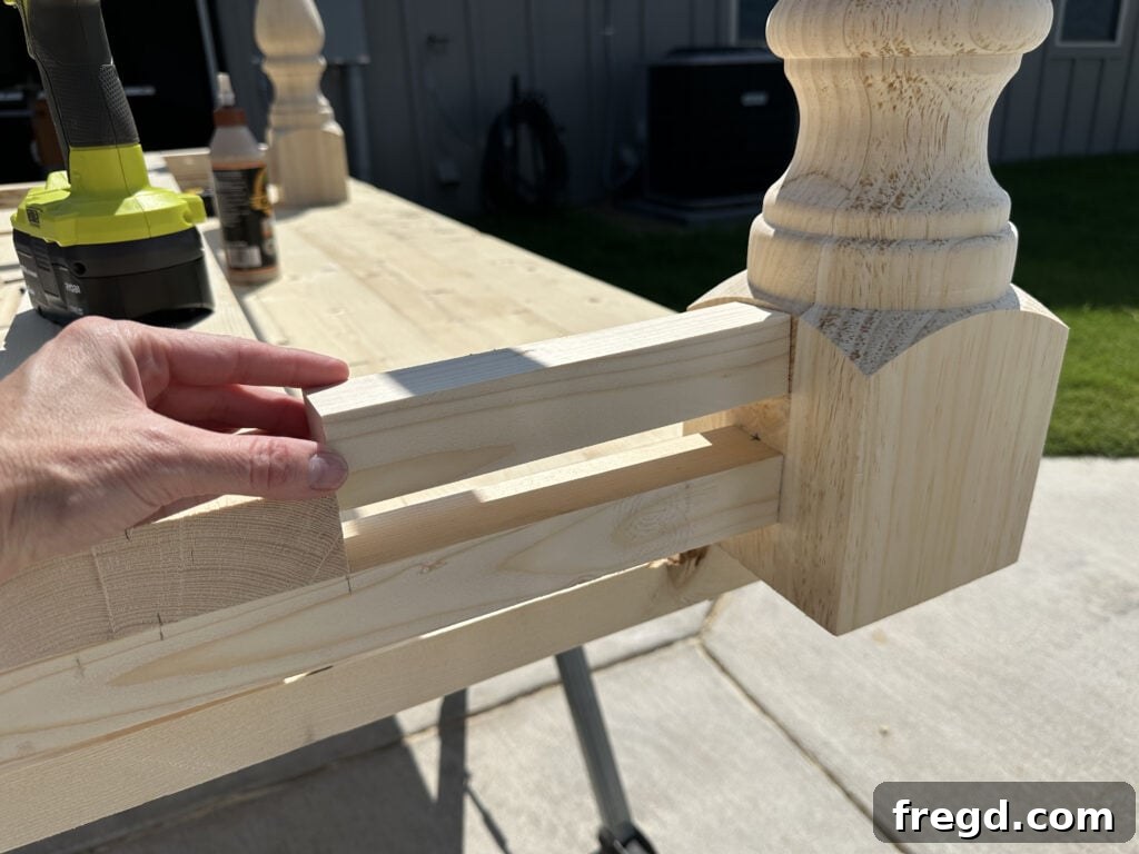 Build Your Own Dining Table with Free DIY Plans 14 Measuring and cutting short trim pieces for the table base
