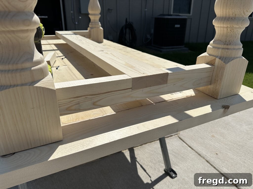 Build Your Own Dining Table with Free DIY Plans 16 Detail shot of the short trim pieces completing the runner support