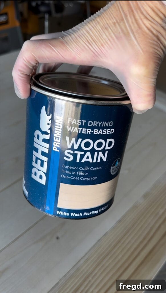 Build Your Own Dining Table with Free DIY Plans 20 Applying BEHR White Wash Pickling stain to the dining table