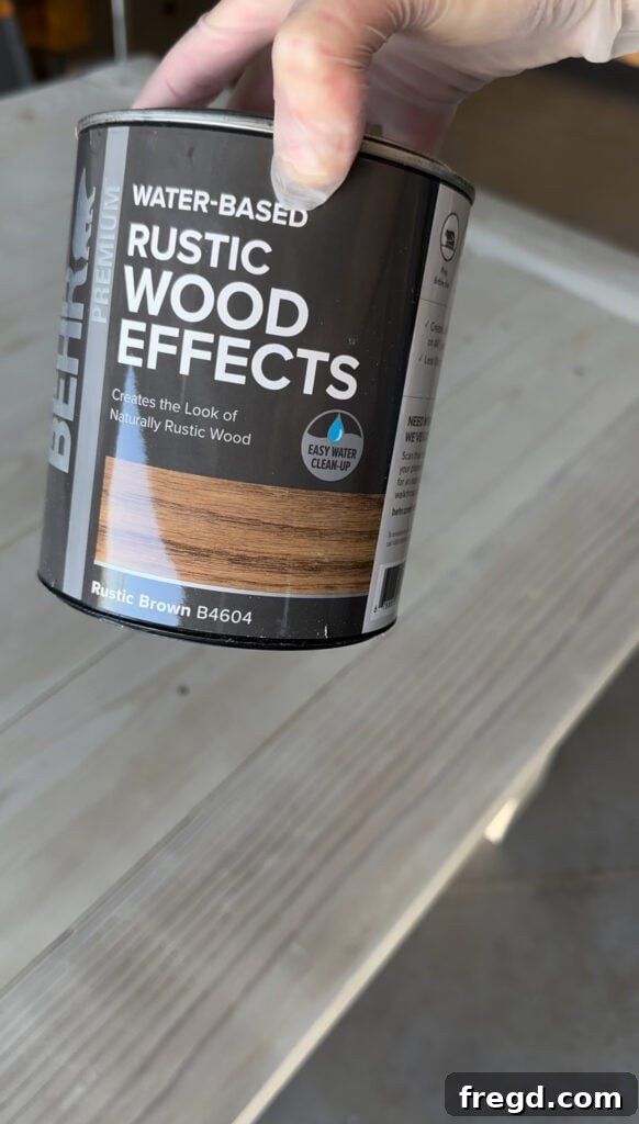 Build Your Own Dining Table with Free DIY Plans 22 Applying BEHR Rustic Wood Effects in Rustic Brown over the pickling stain