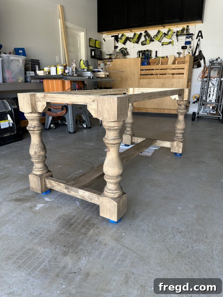 Build Your Own Dining Table with Free DIY Plans 25 Using Kreg Project Blocks to elevate the table for easier staining