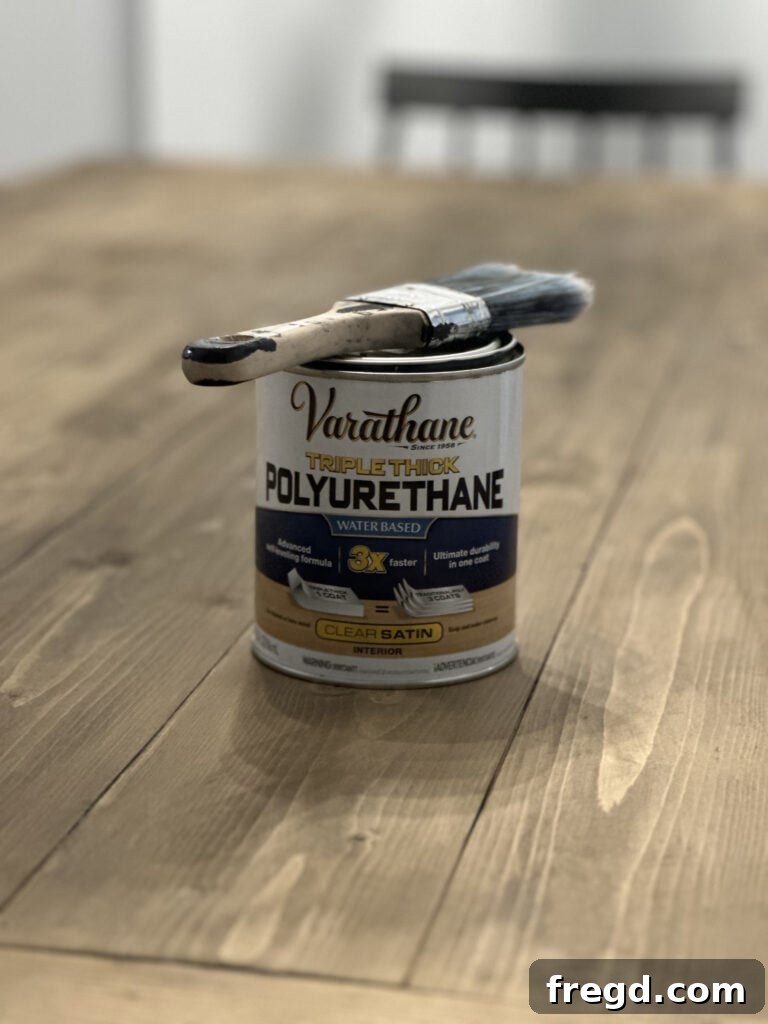 Build Your Own Dining Table with Free DIY Plans 26 Applying Varathane Triple Thick polyurethane to the table top