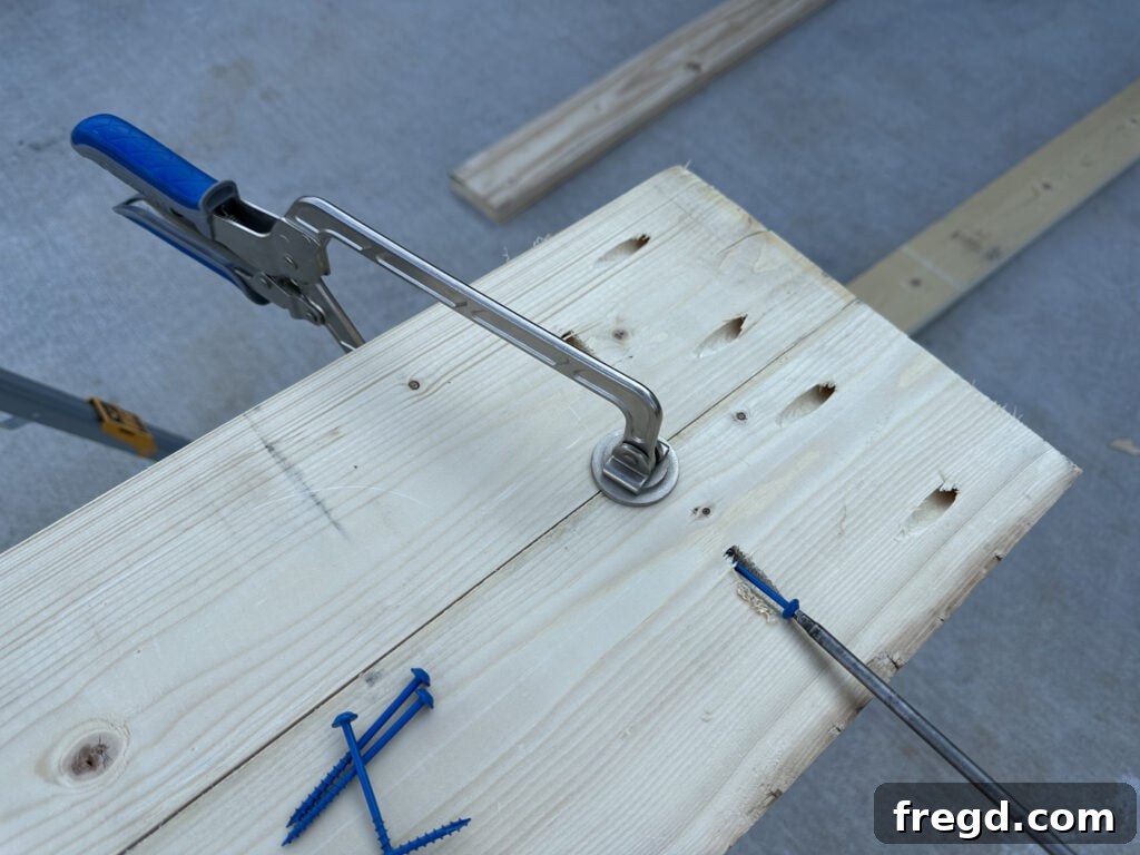 Build Your Own Dining Table with Free DIY Plans 4 Clamping table top planks together with Kreg Face Clamps for a smooth joint