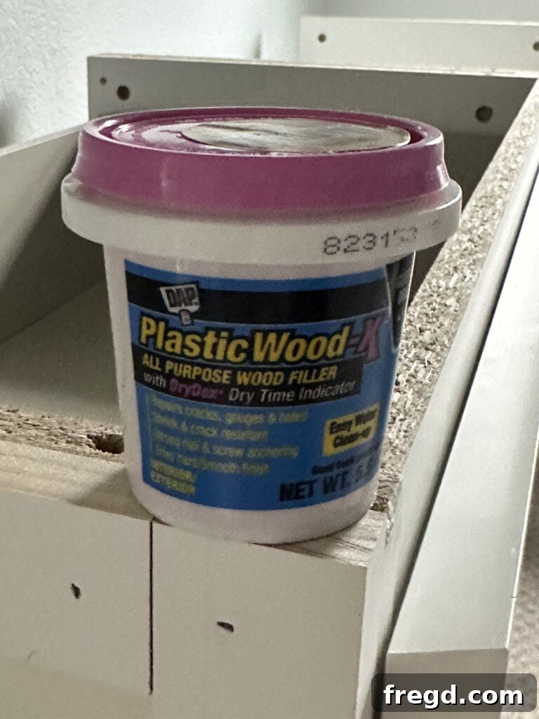 Elevating Your Ikea Malm Dresser 14 Applying wood filler to nail holes