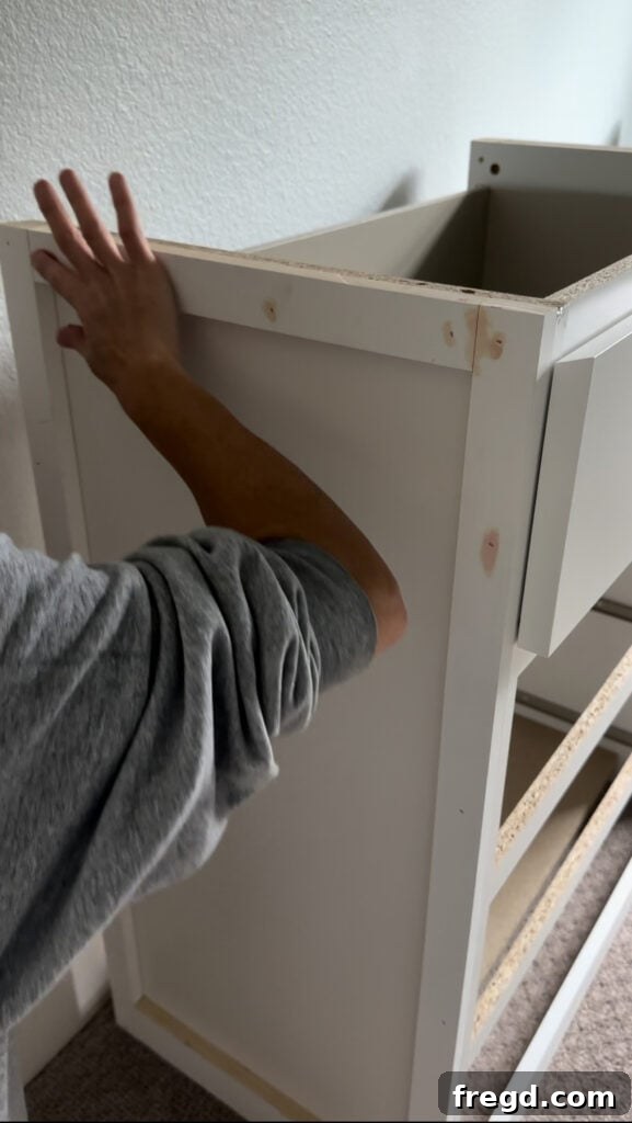 Elevating Your Ikea Malm Dresser 15 Sanding the filled nail holes