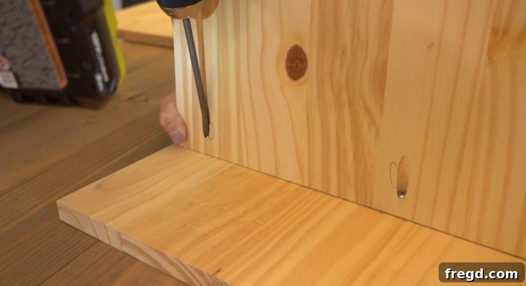 Build Your Own Side Table A Complete Visual Guide 4 Attaching shelves to one side panel using pocket hole screws and wood glue
