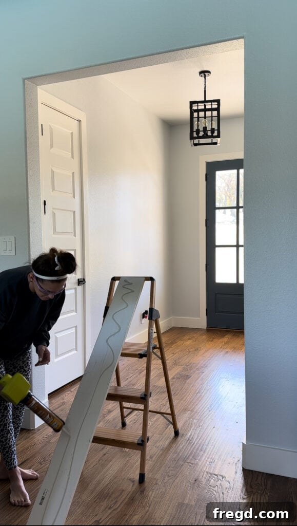 Measuring the width of an opening for the interior top frame board.