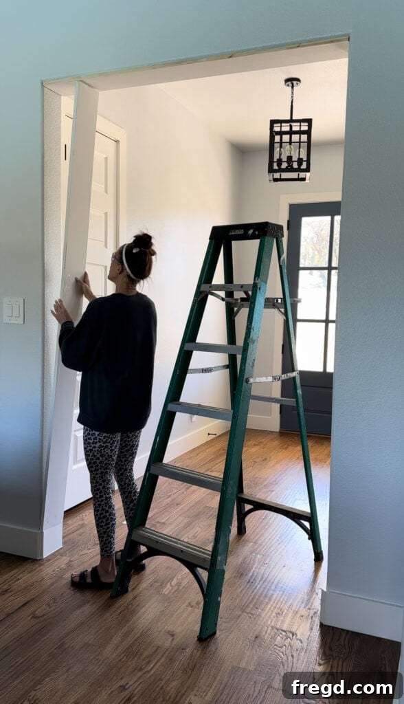 Measuring and cutting vertical frame boards for the inside of the opening.