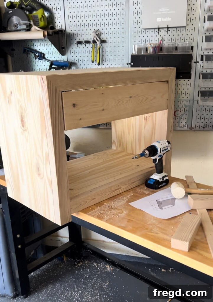 Drawer front being attached with clamps