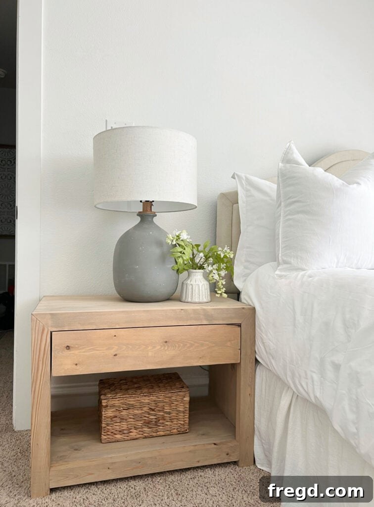 Finished modern DIY nightstand in a styled bedroom
