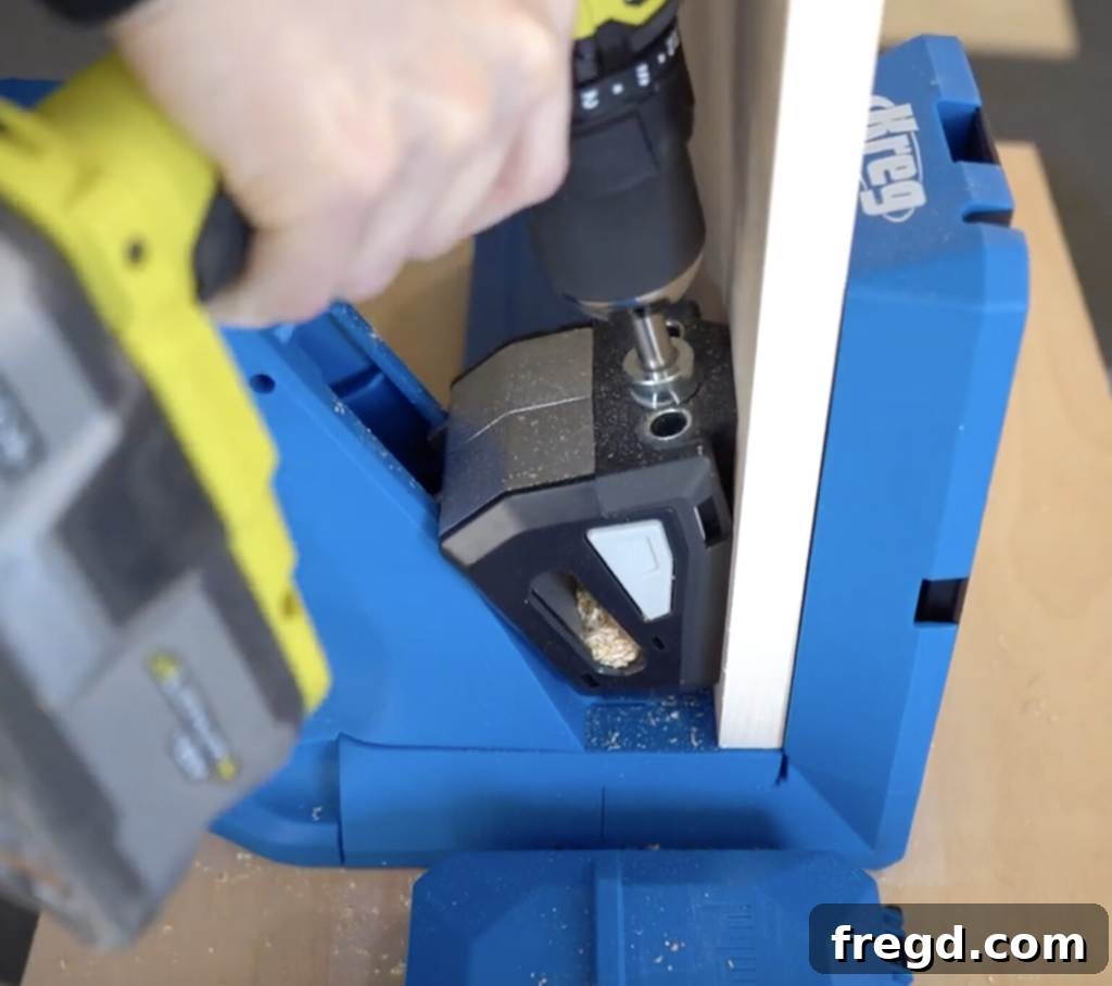 Close-up of a Kreg Jig in use on a piece of wood