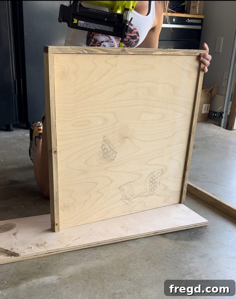 Nature's Eternal Canvas 12 Securing the top and bottom trim pieces to complete the wooden frame