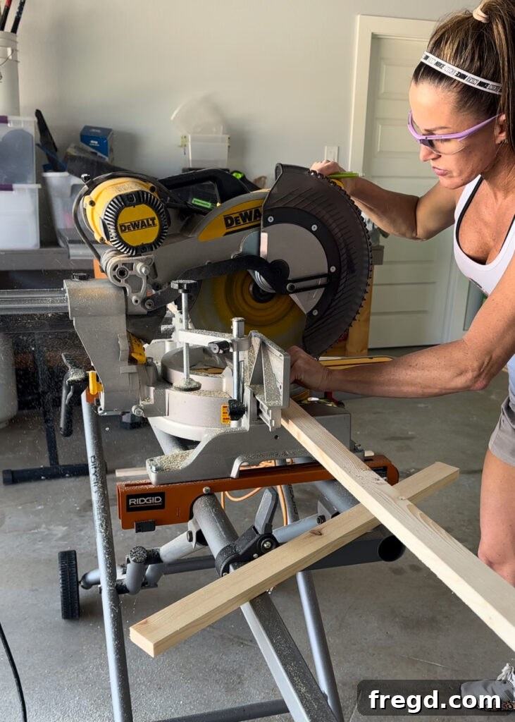 Nature's Eternal Canvas 7 Cutting 1x2 pine boards for the frame trim using a miter saw