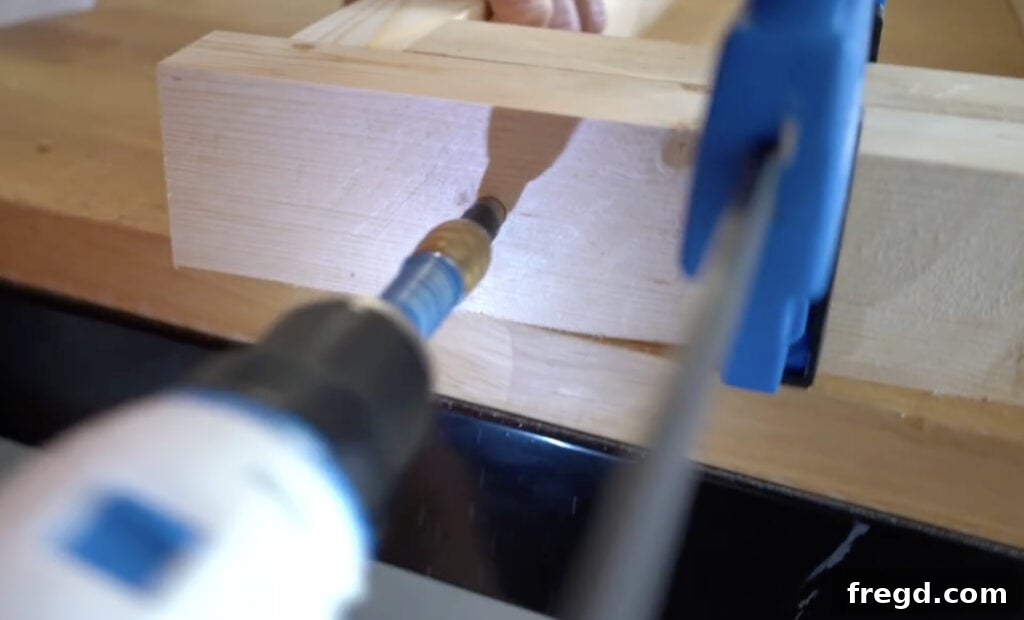 Wood glue being applied to a joint before screwing, ensuring maximum strength.