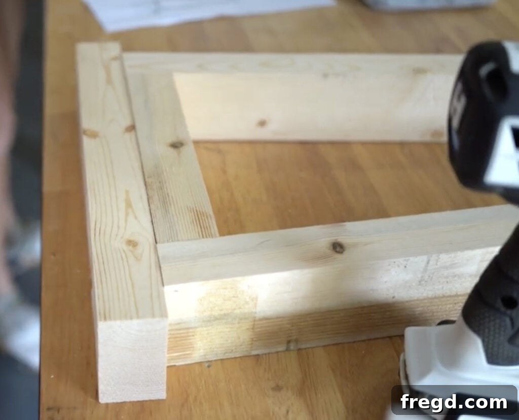 A Kreg Quick-Flip tool being used to countersink screws into the foot piece.