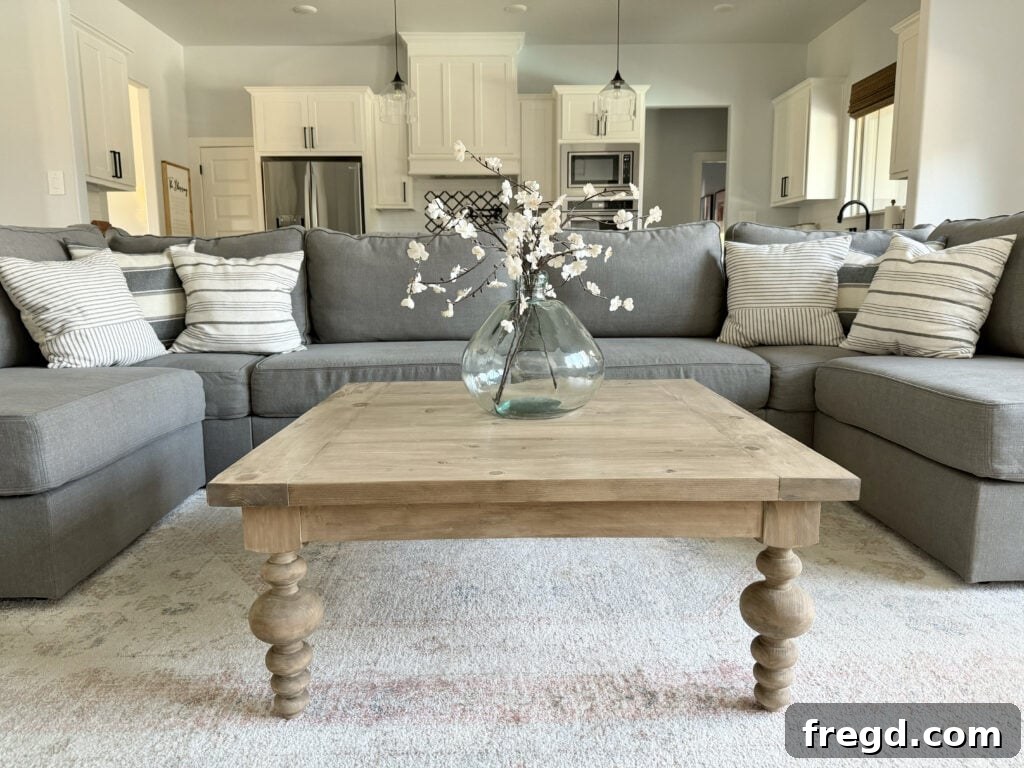 Completed DIY turned leg coffee table styled in a cozy living room setting