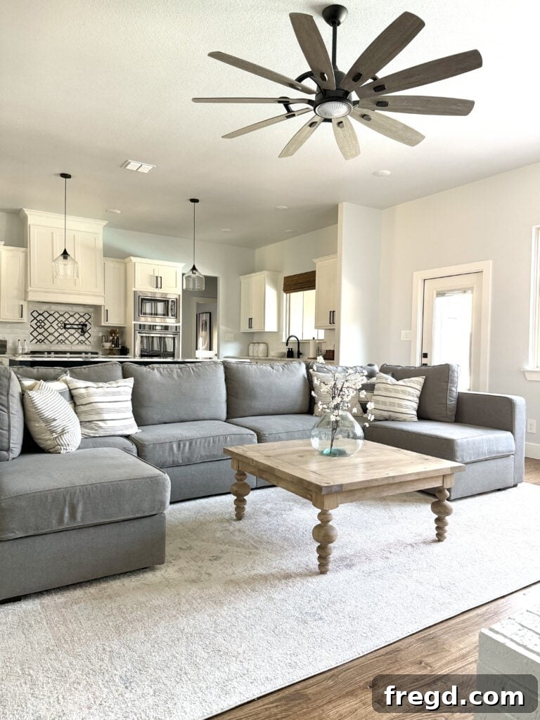 The square coffee table serving as a focal point in a stylish, cozy living room
