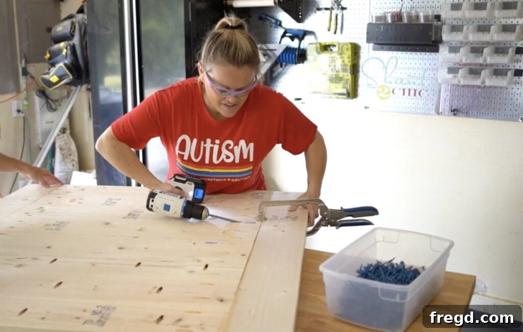 Attaching the breadboard pieces to the ends of the planked tabletop